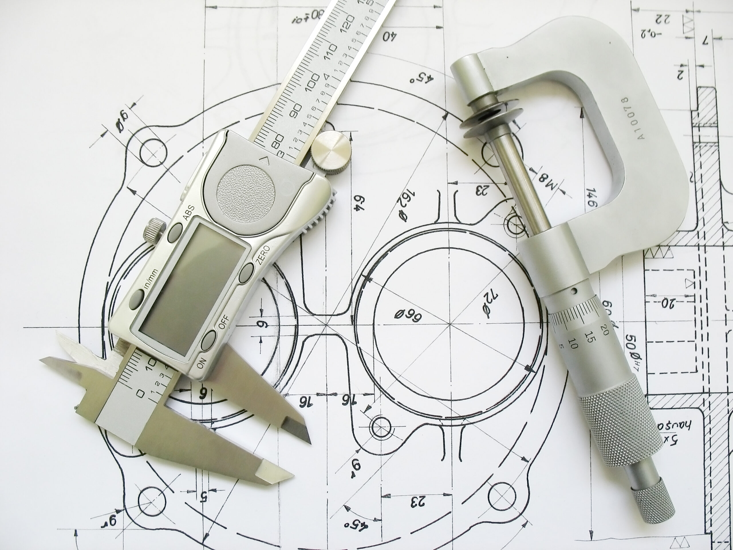 392394_engineering-tools-on-technical-drawing-digital-caliper-and-micrometer